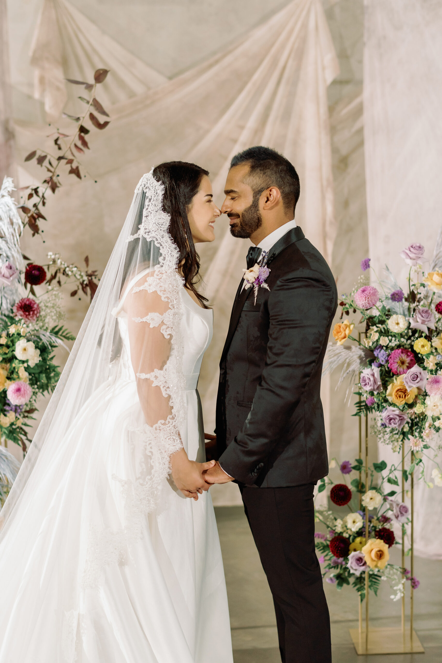 newlyweds in front of alter