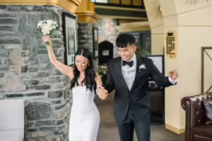 Newlywed couple entering their reception