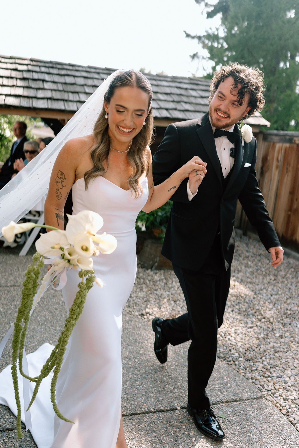 Newlywed couple leaving their ceremony
