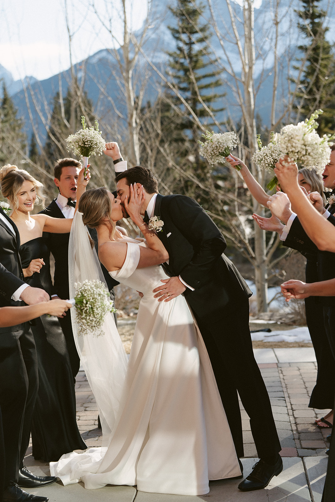 Newlyweds kissing on patio